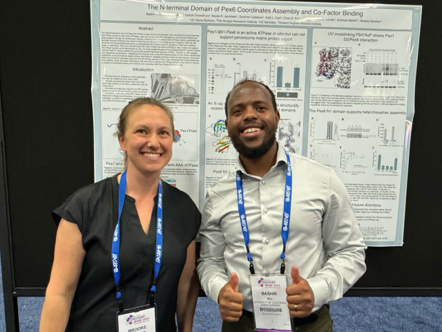 Brooke and Bashir in front of Bashir's poster