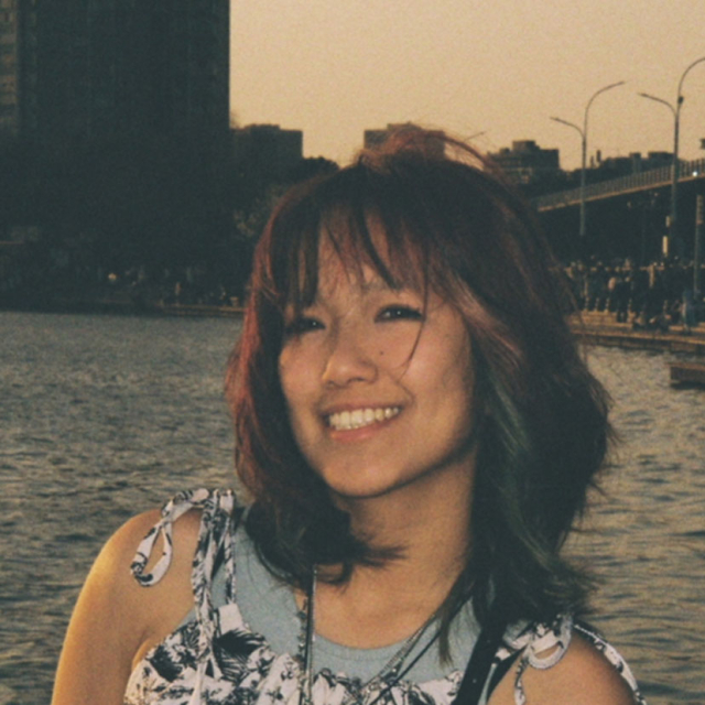 picture of Michelle in front of water and buildings